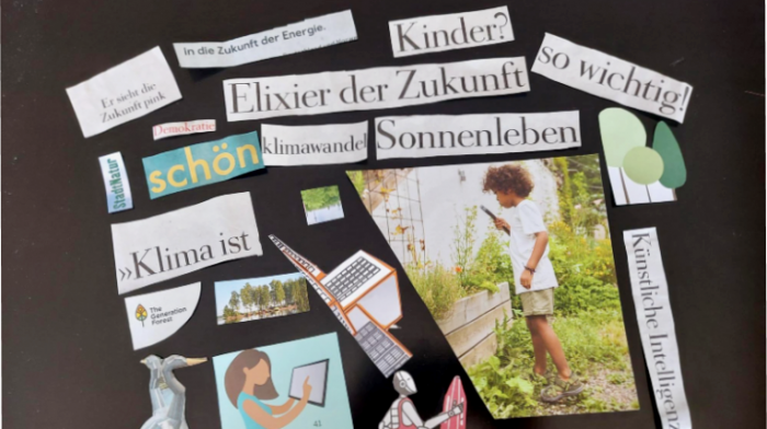 ausgeschnittene Sätze und Bilder sind auf einem schwarzen Tisch angereiht